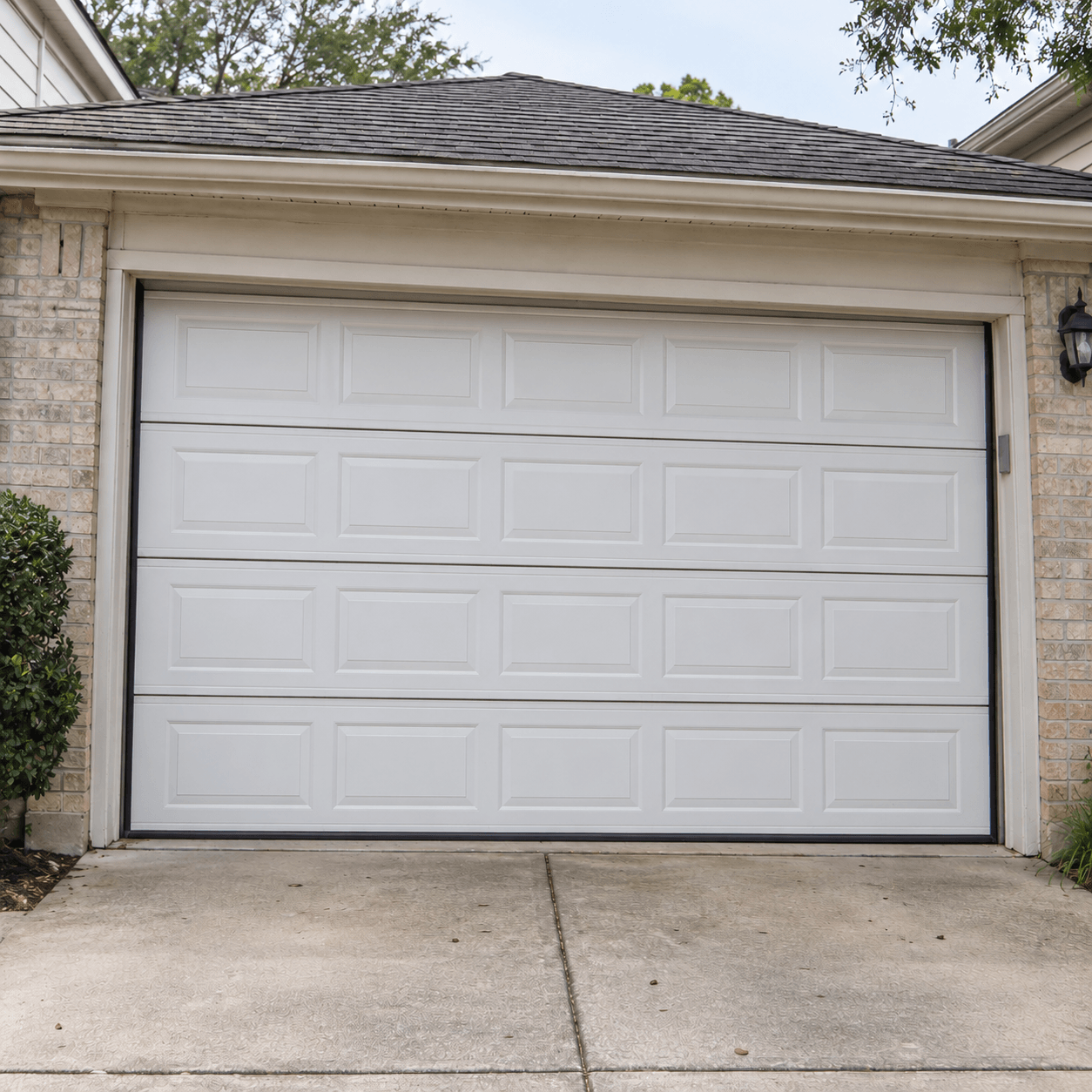 Fixed and properly aligned residential garage door after repair by Garage Door South Houston TX